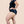 Model wears the prolapse support underwear from Hem Support Wear. Side view of model wearing Curvy 1x