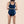 Model shows back view of Hem Support wear's prolapse support underwear
